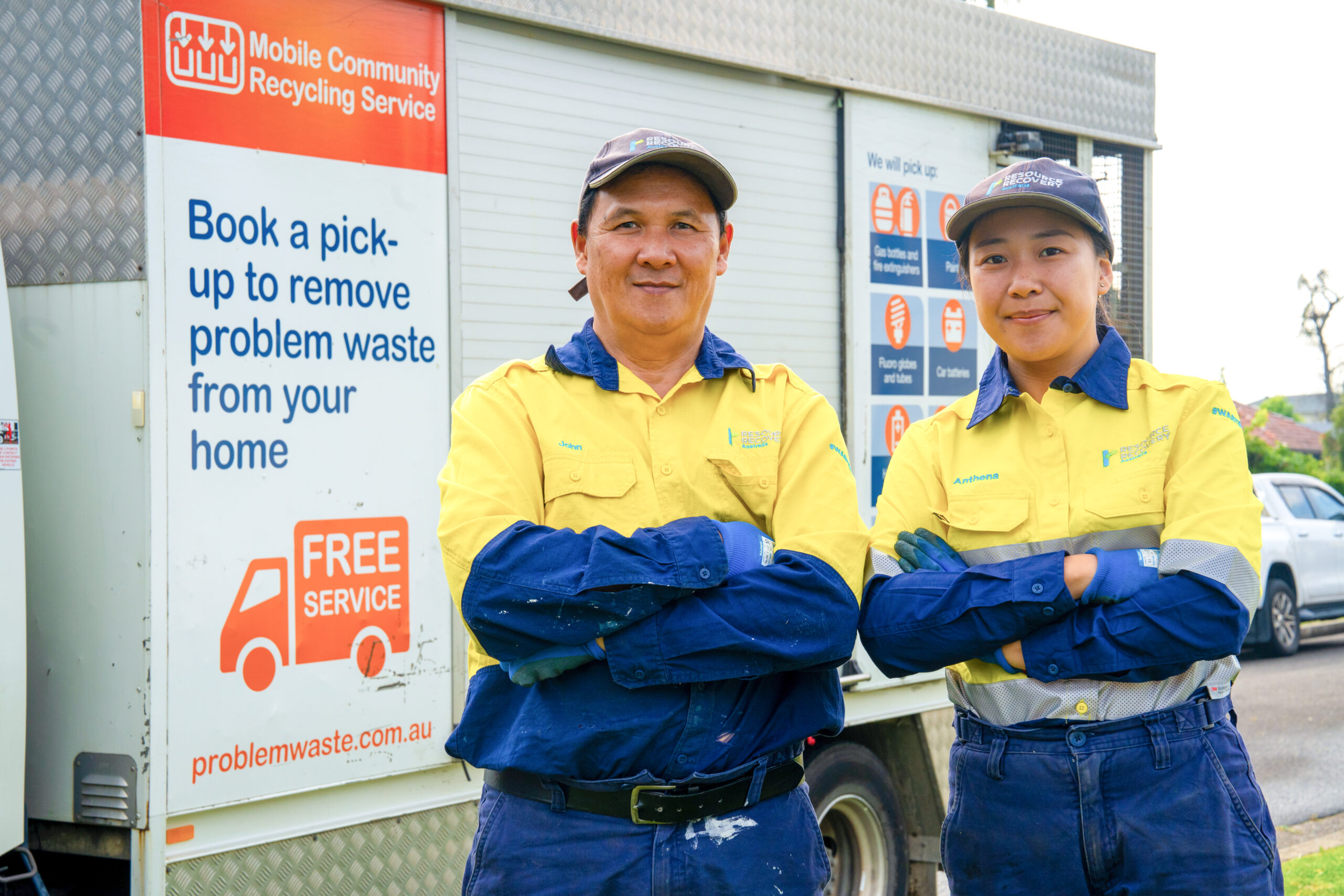 Man Using Measuring Tape in Factory Setting Man Using Measuring Tape in Factory Setting